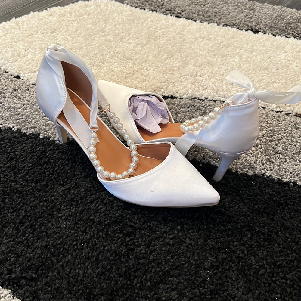 White satin heel and satin bow pearl ankle strap.